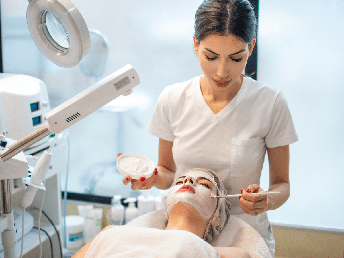 A Valmére Skin Science licensed aesthetician facilitating a client skincare treatment.