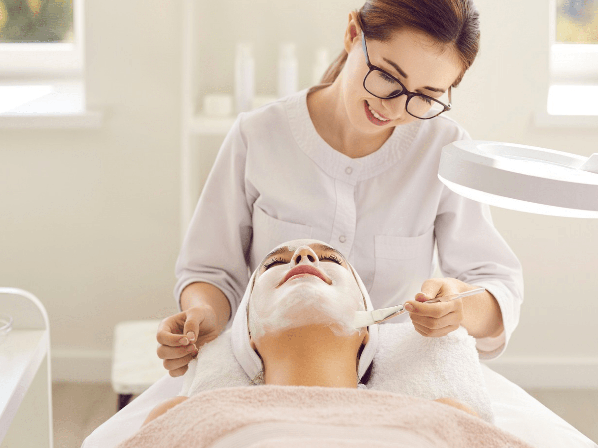 A Valmére Skin Science licensed aesthetician facilitating a client skincare treatment.