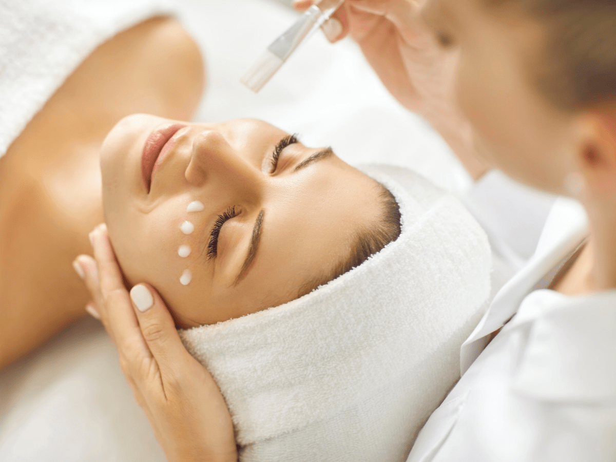 A Valmére Skin Science licensed aesthetician facilitating a client skincare treatment.